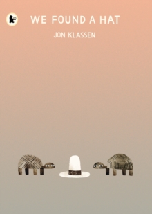 Cover of We Found A Hat. a pink to grey graded background. At the bottom are two turtles, standign either side of a tall white hat with a black band around it.